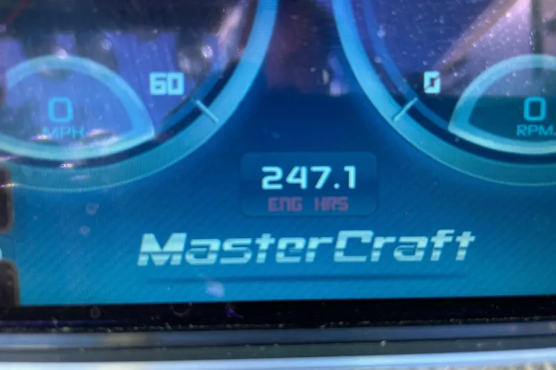 Slide: The Image of Dashboard of 2013 MasterCraft XStar showing 247.1 engine hours. - 13