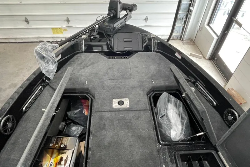Slide: The Image of 2026 Skeeter WXR2060 F boat interior with storage compartments and equipment. - 12