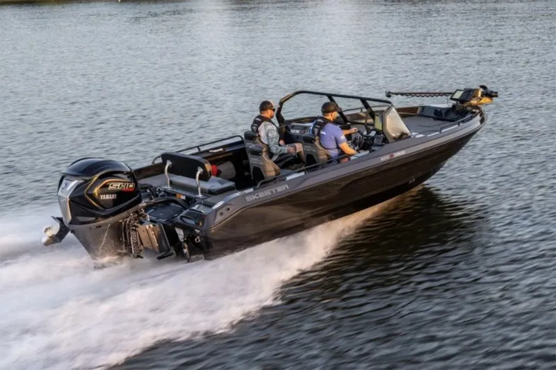 Slide: The Image of Manufacturer Provided Image: 2026 Skeeter WXR2060 F boat cruising on a lake with two passengers. - 23