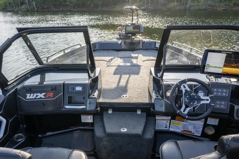 Slide: The Image of Manufacturer Provided Image: 2026 Skeeter WXR2060 F boat interior with advanced navigation system on a serene lake. - 32