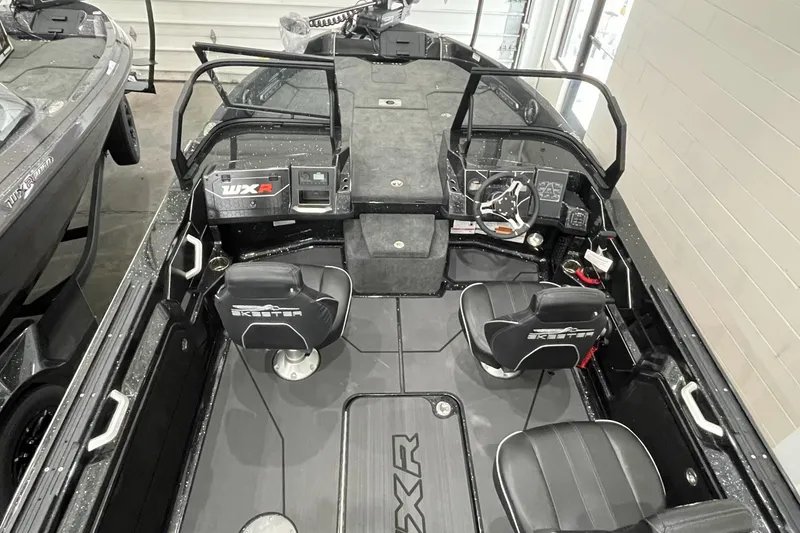 Slide: The Image of 2026 Skeeter WXR2060 F boat interior with dual seats and modern dashboard. - 4
