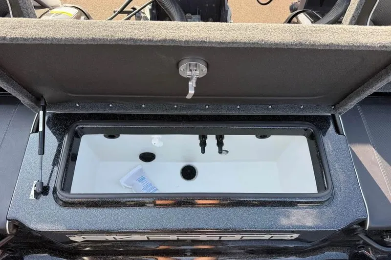 Slide: The Image of Open storage compartment of 2026 Skeeter WXR2060 F boat, showcasing interior features. - 6