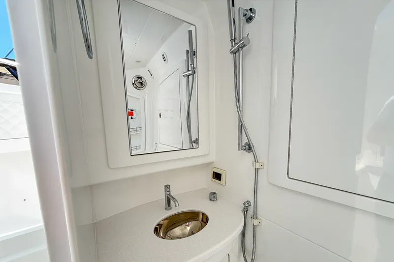 Slide: The Image of Intrepid 43 Nomad SE 2026 bathroom with mirror and sink. - 13