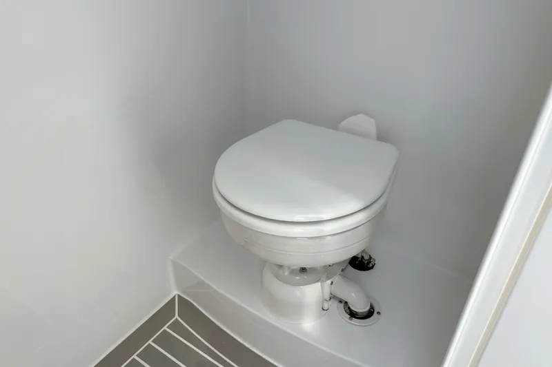 Slide: The Image of Marine toilet in the 2026 Intrepid 43 Nomad SE model. - 14