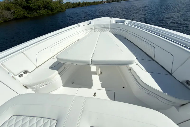 Slide: The Image of Intrepid 43 Nomad SE 2026, luxurious boat seating area on calm water. - 18