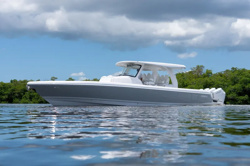 Slide: The Image of Intrepid 43 Nomad SE 2026 on calm water under cloudy sky. - 28