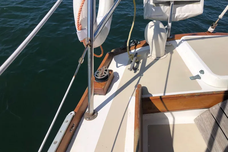 Slide: The Image of 1979 Cape Dory 36 sailboat deck with rigging and wooden trim details. - 4