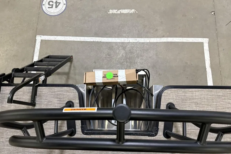 Slide: The Image of 2026 Godfrey Sweetwater 22' Tritoon boat interior with split bench and ladder. - 9