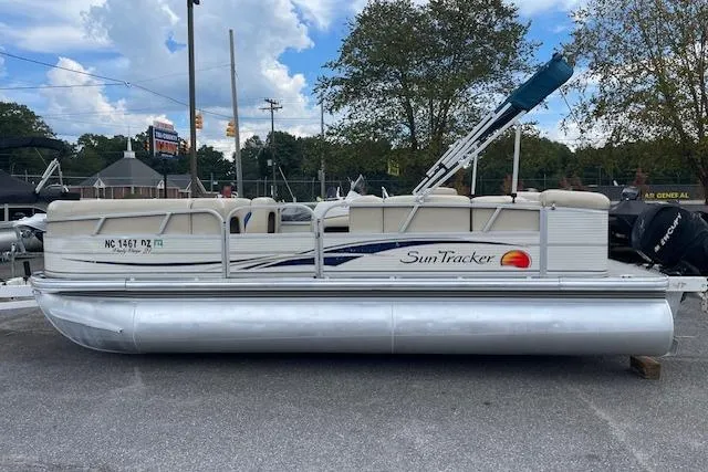 The Image of 2009 Sun Tracker Party Barge 21 pontoon boat parked on pavement. - 1