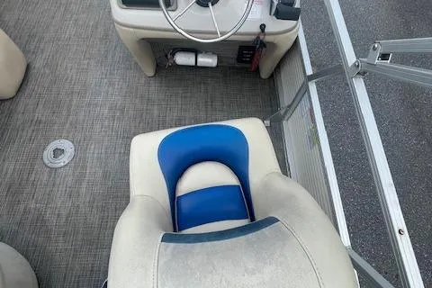 Slide: The Image of 2009 Sun Tracker Party Barge 21 interior with steering wheel and seating. - 4