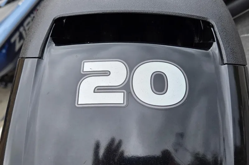 Slide: The Image of Close-up of a 2014 Lowe Stryker 17 outboard motor with "20" decal. - 4