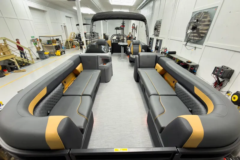 Slide: The Image of 2026 Godfrey Sweetwater 22' Split Bench Tritoon interior with luxurious seating and modern design. - 10