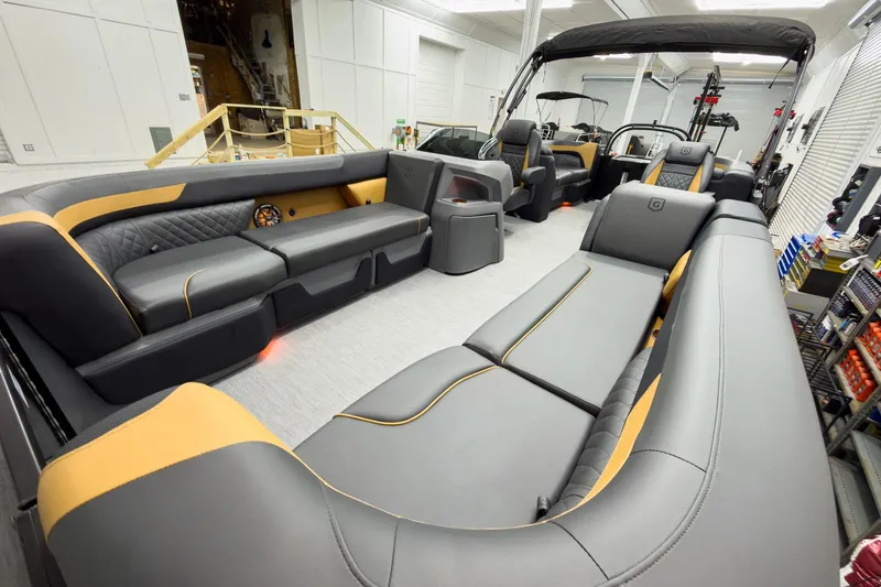 Slide: The Image of Luxurious interior of 2026 Godfrey Sweetwater 22' Split Bench Tritoon, featuring sleek seating. - 11