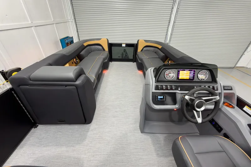 Slide: The Image of Interior of 2026 Godfrey Sweetwater 22' Split Bench Tritoon, featuring modern helm and seating. - 30