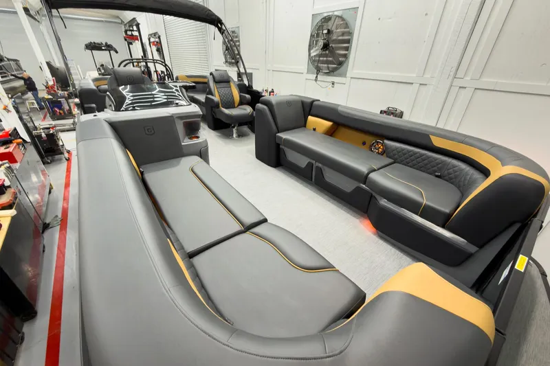 Slide: The Image of Luxurious interior of 2026 Godfrey Sweetwater 22' Split Bench Tritoon, featuring sleek seating design. - 9
