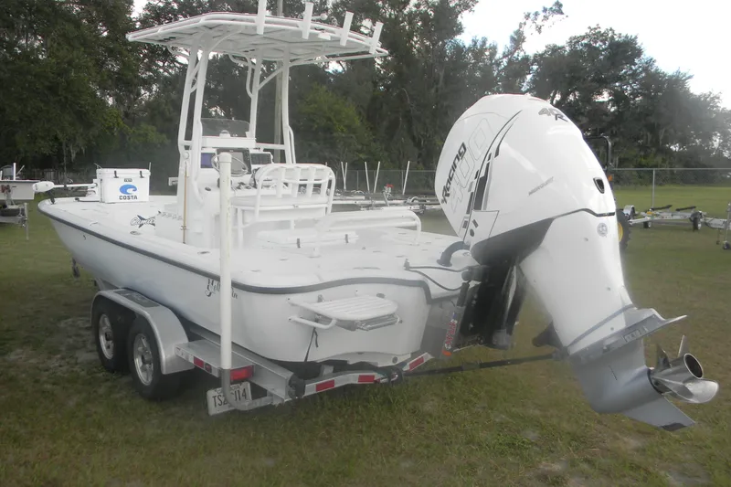 Slide: The Image of 2013 Yellowfin 24 Bay boat with powerful outboard motor on trailer. - 3