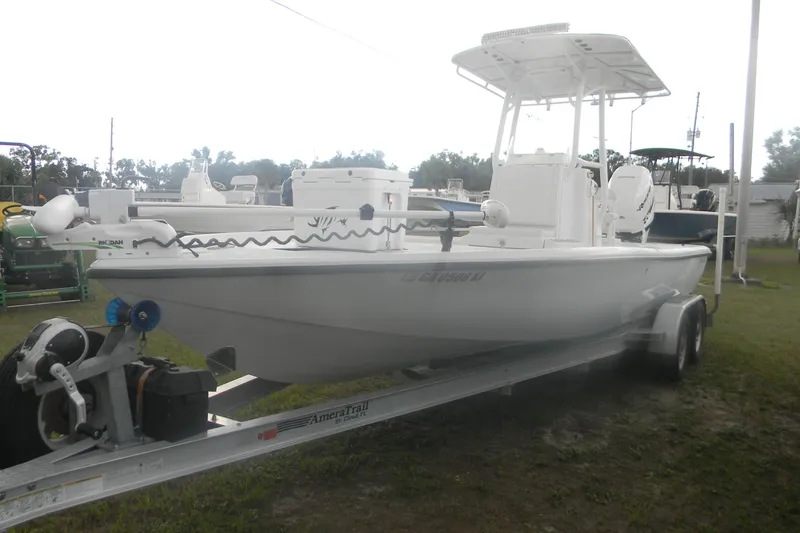 Slide: The Image of 2013 Yellowfin 24 Bay boat on trailer, parked outdoors. - 6