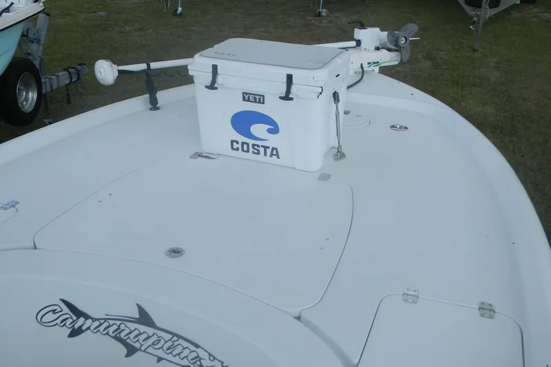 Slide: The Image of 2013 Yellowfin 24 Bay boat deck with Yeti cooler and trolling motor. - 7
