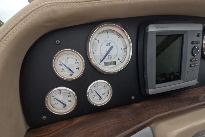 Slide: The Image of Dashboard of 2012 Four Winns V265 boat with gauges and Garmin GPS. - 34