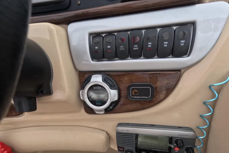 Slide: The Image of 2012 Four Winns V265 dashboard with control panel and Sony audio system. - 37