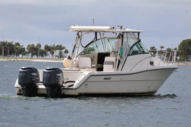 The Image of 2006 Pursuit 3070 Offshore boat with twin Yamaha engines on the water. - 1