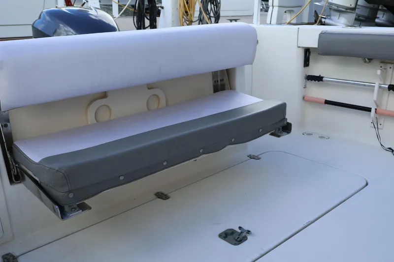 Slide: The Image of 2006 Pursuit 3070 Offshore boat with foldable seating and storage compartment. - 10