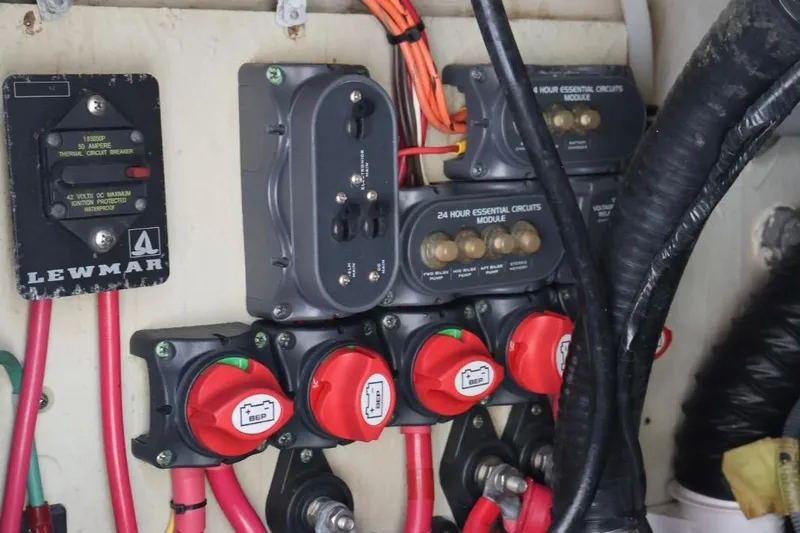 Slide: The Image of Electrical panel of a 2006 Pursuit 3070 Offshore boat with circuit breakers and wiring. - 11
