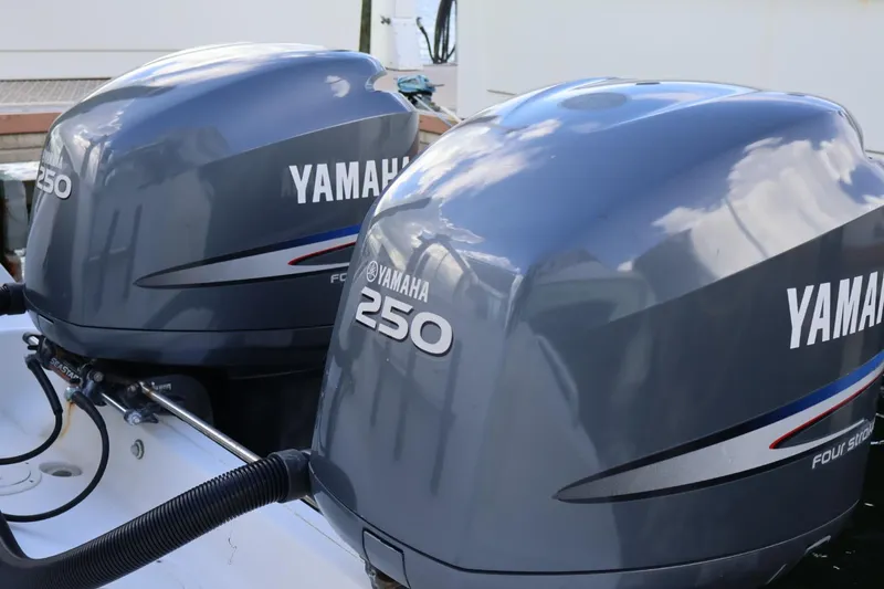 Slide: The Image of Twin Yamaha 250 outboard engines on a 2006 Pursuit 3070 Offshore boat. - 13
