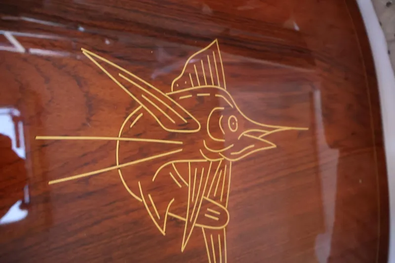 Slide: The Image of Wooden marlin engraving on 2006 Pursuit 3070 Offshore boat. - 23