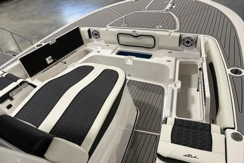 Slide: The Image of 2025 Tidewater 3100 Carolina Bay boat interior with sleek seating and storage compartments. - 11