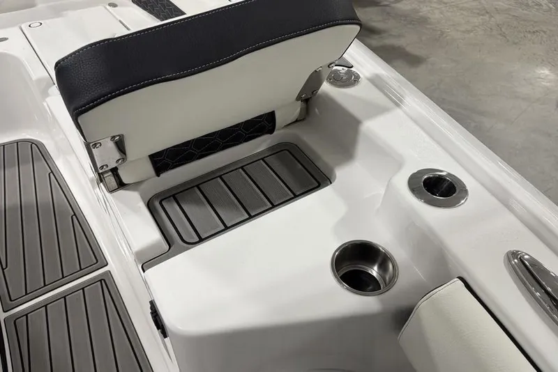 Slide: The Image of 2025 Tidewater 3100 Carolina Bay boat interior with seating and cup holders. - 17