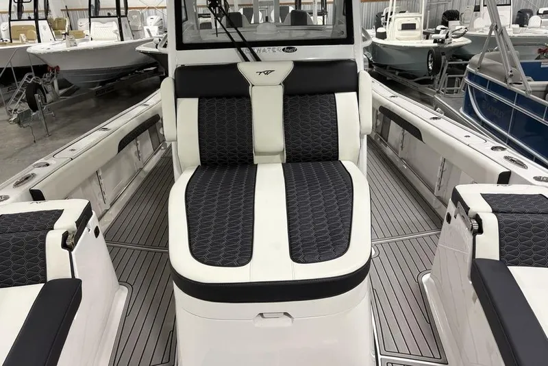Slide: The Image of 2025 Tidewater 3100 Carolina Bay boat interior with sleek seating and modern design. - 18