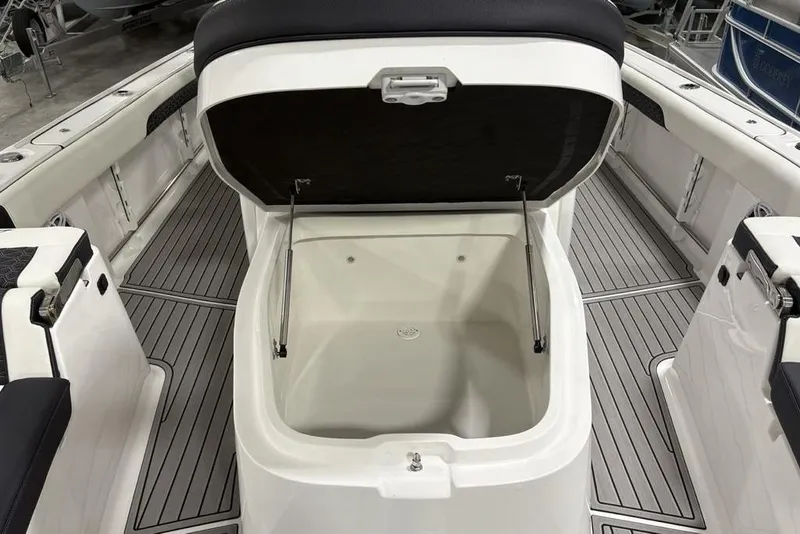 Slide: The Image of 2025 Tidewater 3100 Carolina Bay boat with open storage compartment, sleek deck design. - 19