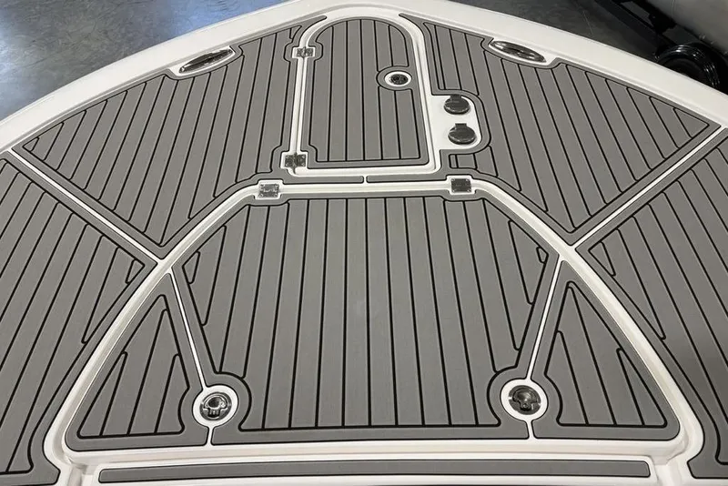 Slide: The Image of 2025 Tidewater 3100 Carolina Bay boat deck with sleek, modern design and gray non-slip surface. - 2