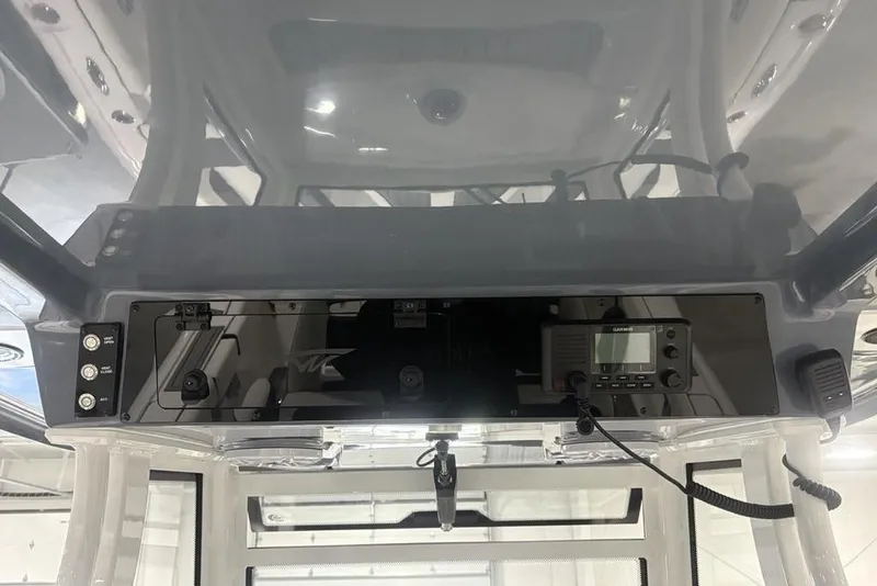 Slide: The Image of 2025 Tidewater 3100 Carolina Bay boat console with modern navigation equipment. - 32