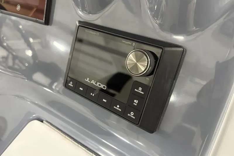 Slide: The Image of JL Audio system on 2025 Tidewater 3100 Carolina Bay boat dashboard. - 34