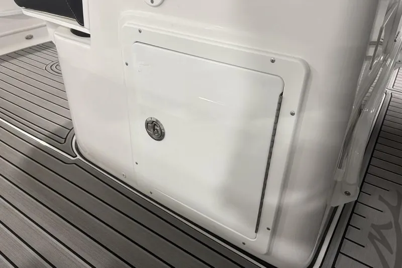 Slide: The Image of 2025 Tidewater 3100 Carolina Bay boat interior with sleek storage compartment and non-slip flooring. - 35