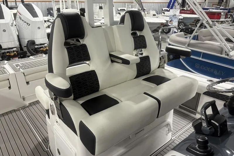Slide: The Image of 2025 Tidewater 3100 Carolina Bay boat interior with luxurious seating and modern controls. - 38
