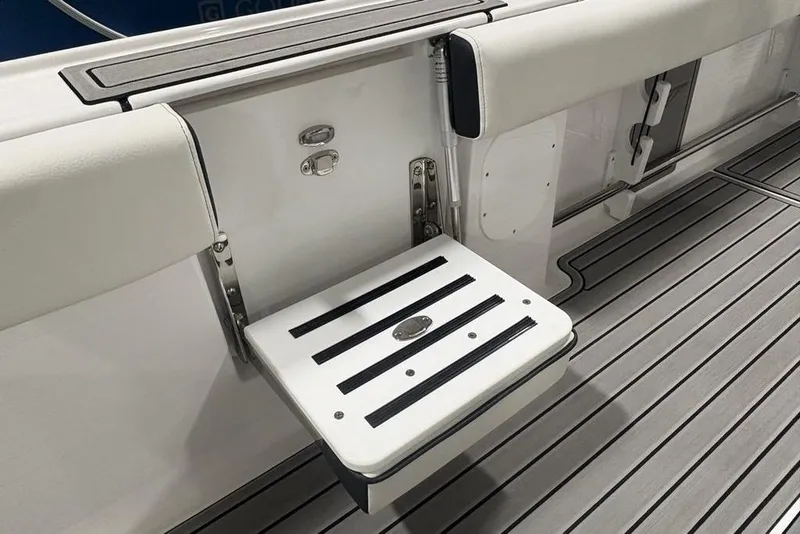 Slide: The Image of 2025 Tidewater 3100 Carolina Bay boat interior with foldable seat and sleek flooring. - 42