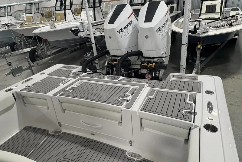 Slide: The Image of 2025 Tidewater 3100 Carolina Bay boat with dual engines in showroom. - 43