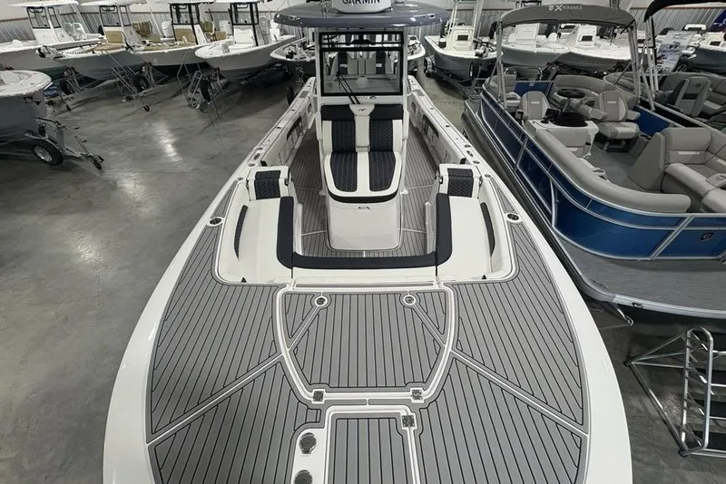 Slide: The Image of 2025 Tidewater 3100 Carolina Bay boat in showroom, featuring sleek design and spacious deck. - 51
