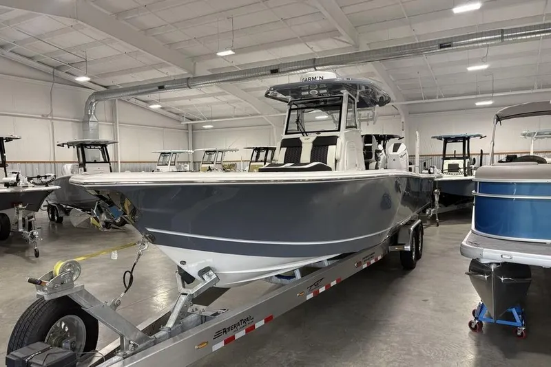 Slide: The Image of 2025 Tidewater 3100 Carolina Bay boat on trailer in showroom. - 6