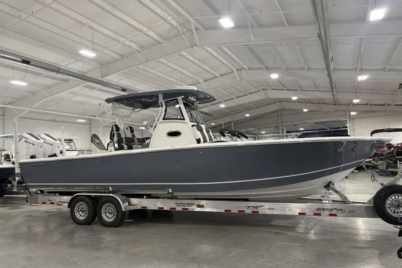 Slide: The Image of 2025 Tidewater 3100 Carolina Bay boat on trailer in showroom. - 9