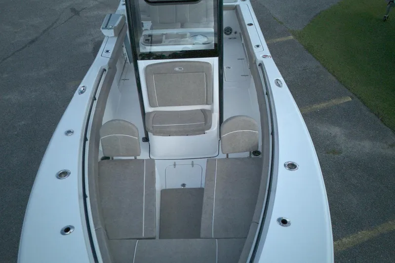 Slide: The Image of 2026 Sea Hunt Gamefish 25 boat interior with cushioned seating and sleek design. - 2