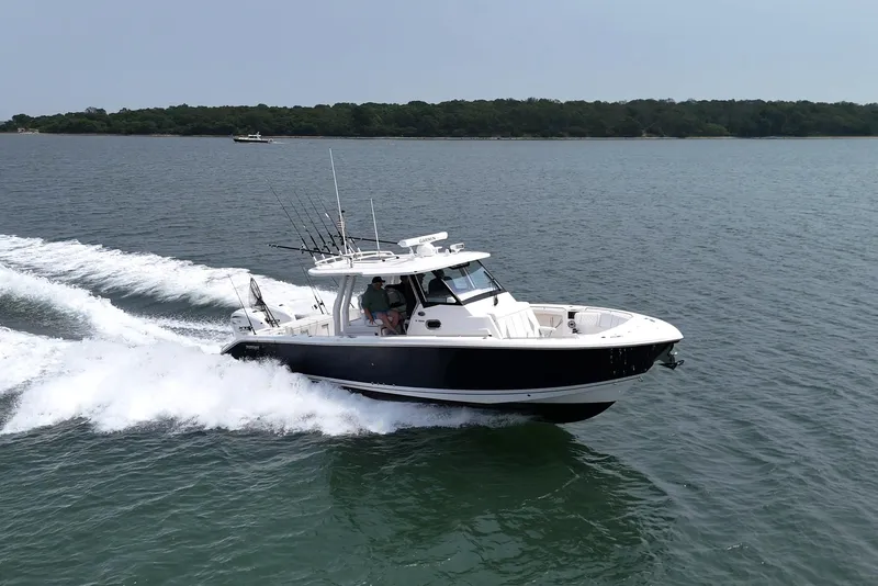 The Image of 2026 Pursuit S 358 boat cruising on open water, showcasing sleek design and performance. - 0