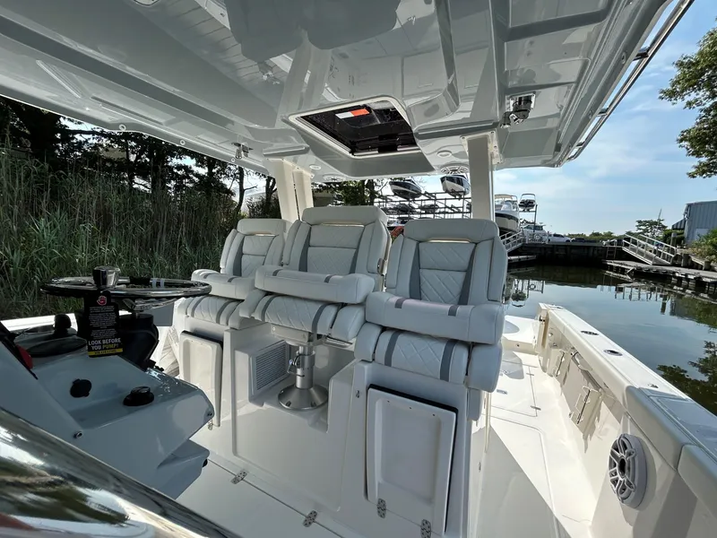 Slide: The Image of Interior of 2026 Pursuit S 358 boat with luxurious seating and modern design. - 13