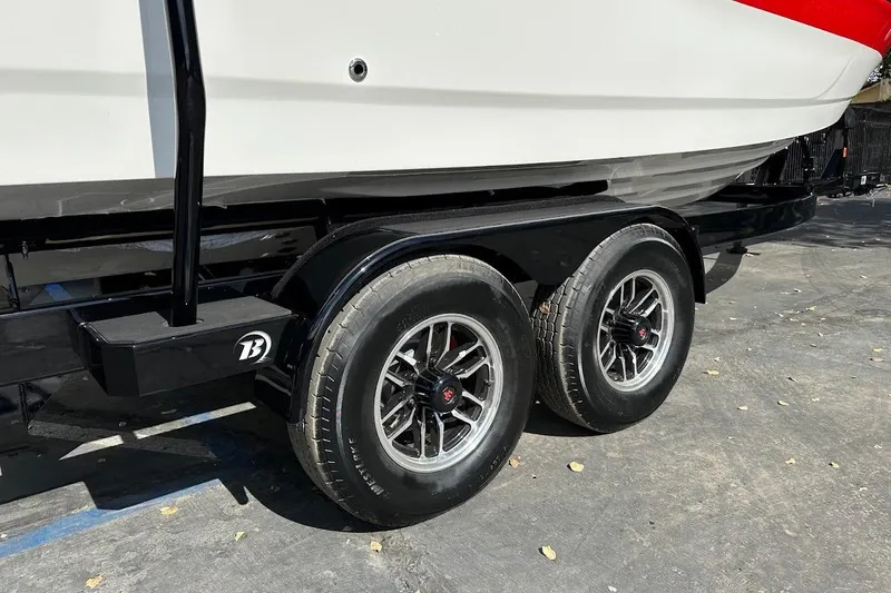 Slide: The Image of Trailer for 2026 Sea Ray SDX 230 Surf boat with dual wheels. - 12