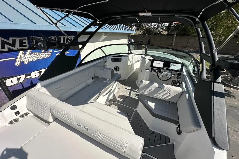 Slide: The Image of 2026 Sea Ray SDX 230 Surf boat interior with modern seating and dashboard. - 15