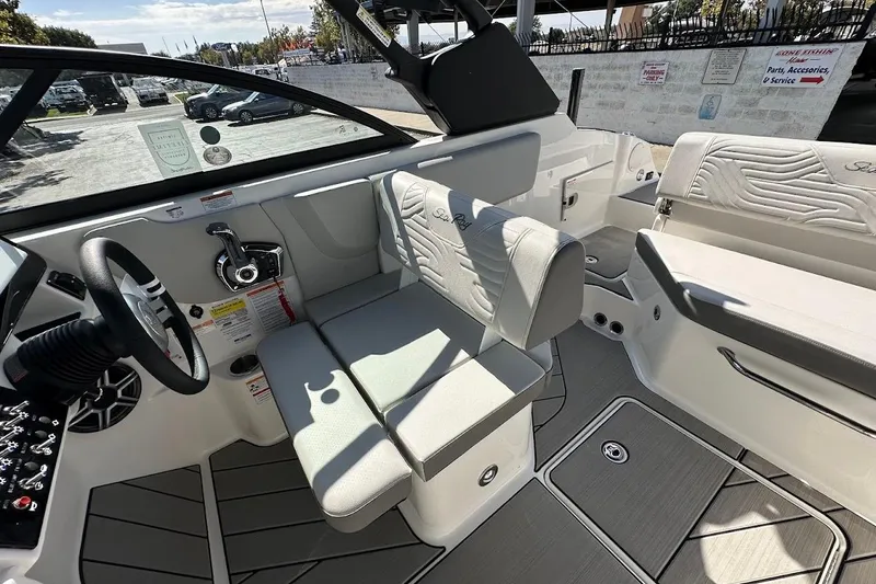 Slide: The Image of Interior of 2026 Sea Ray SDX 230 Surf boat, featuring sleek seating and modern controls. - 21