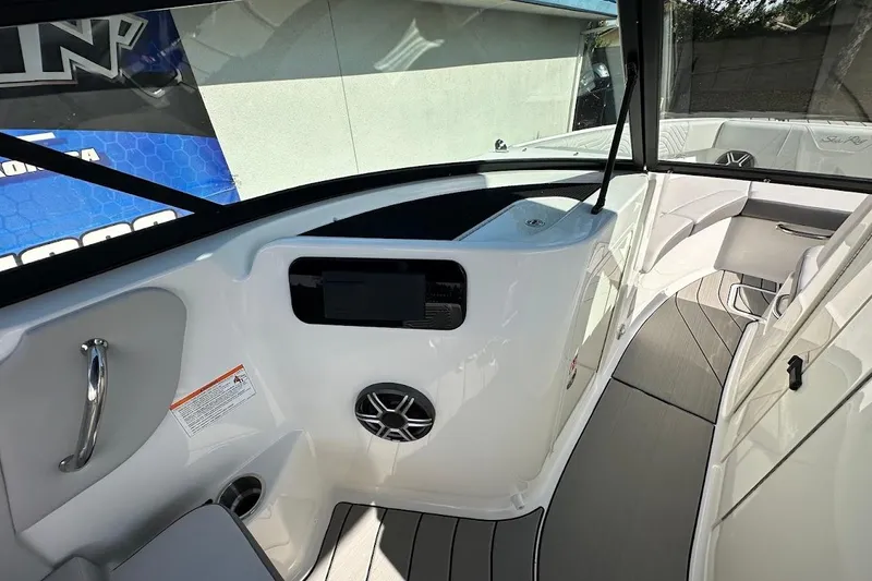 Slide: The Image of 2026 Sea Ray SDX 230 Surf boat interior with sleek design and modern dashboard. - 33